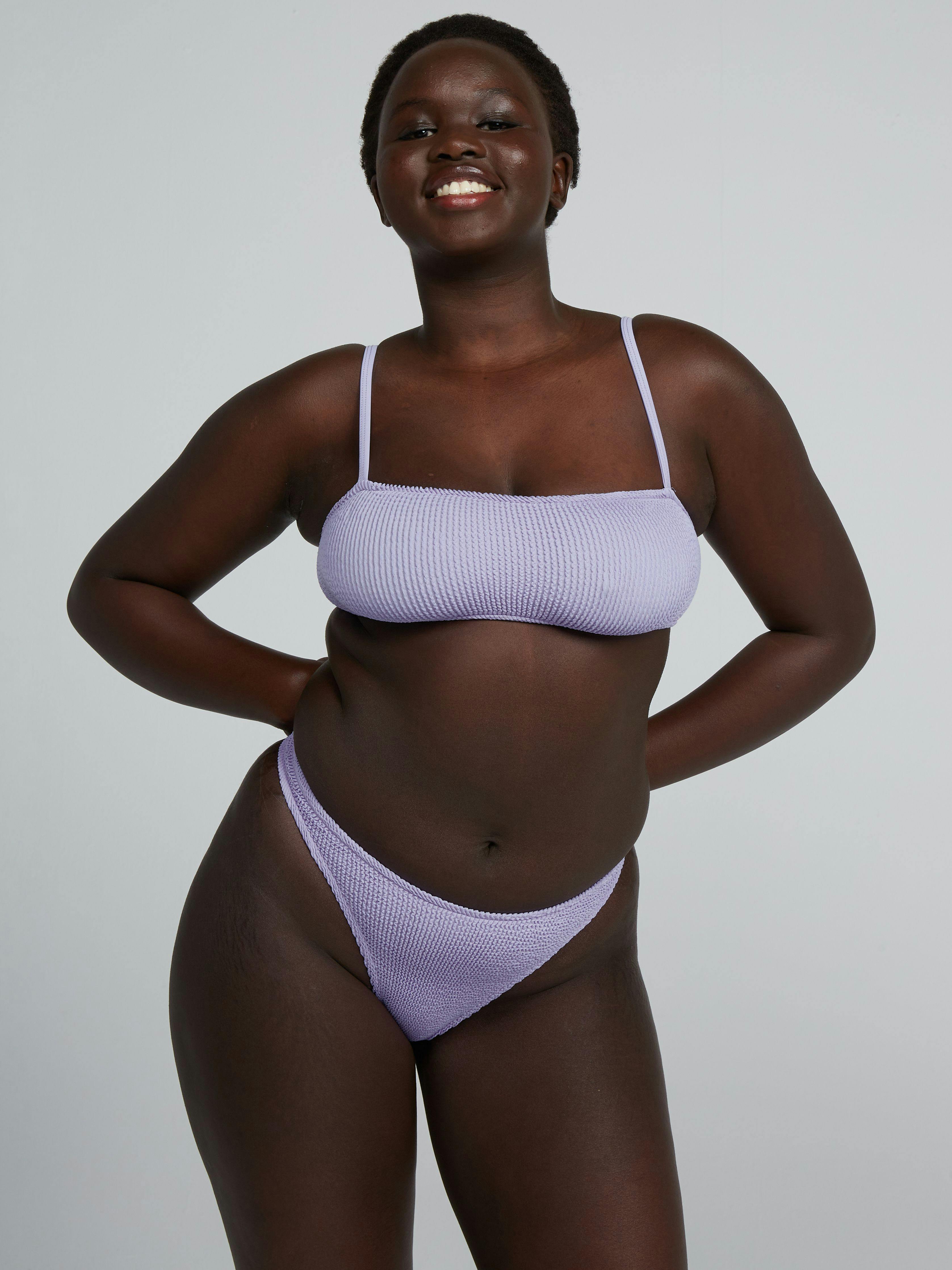 A model wearing Poise Cheeky Two-Piece