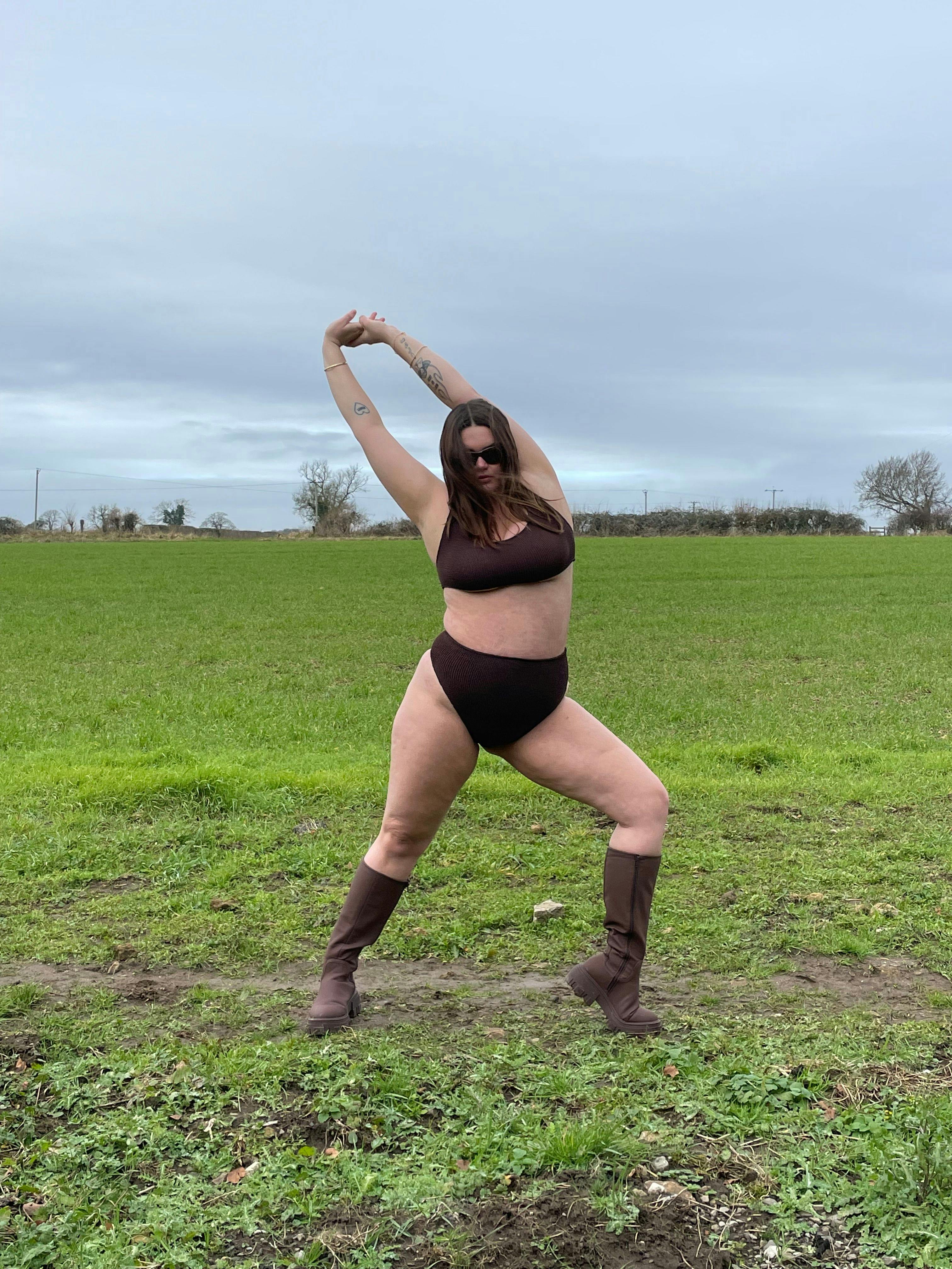 Imogen Ivy wears Youswim bikini dancing in field 