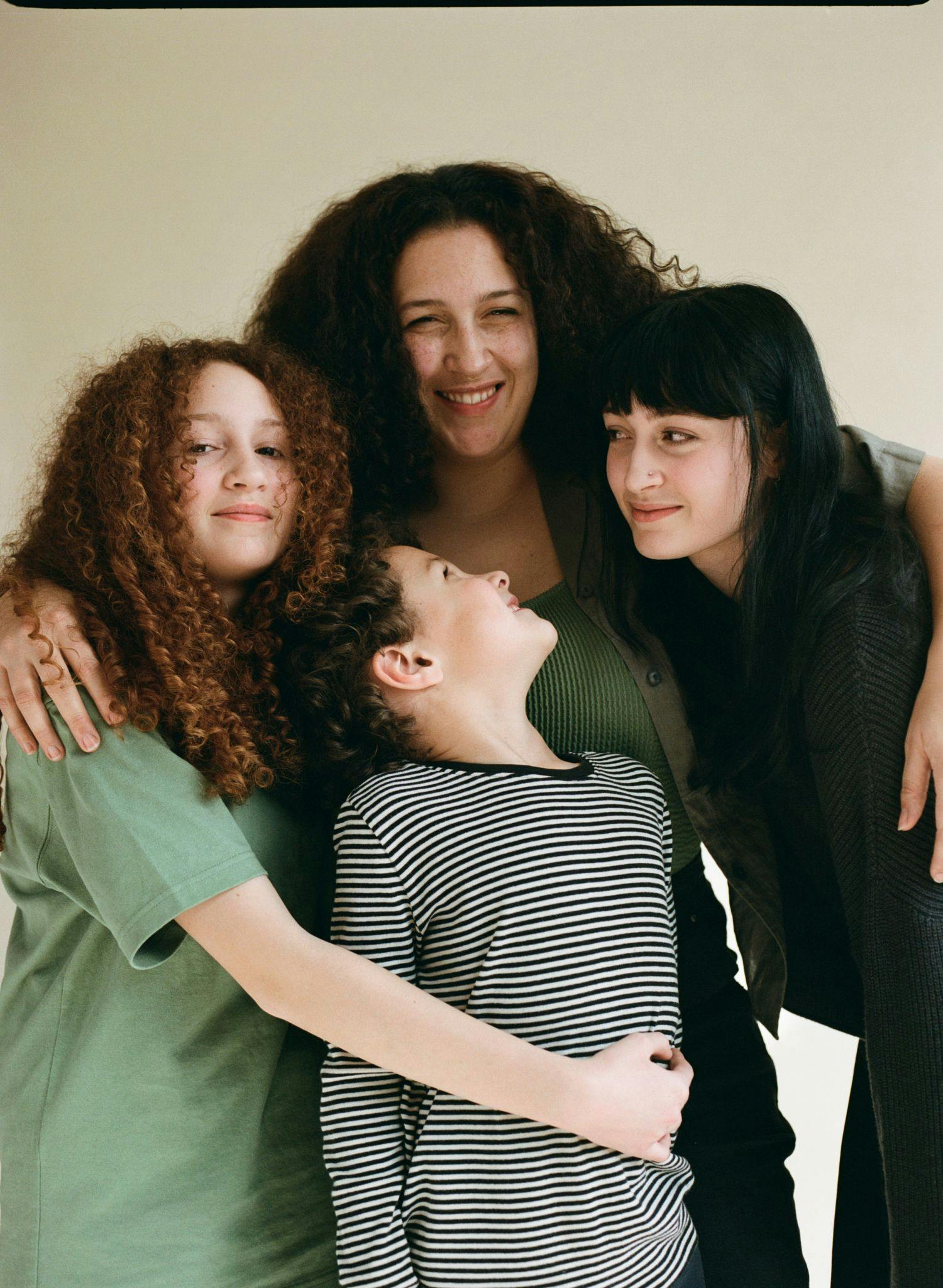 Nanci with her two teenage daughters and young son.